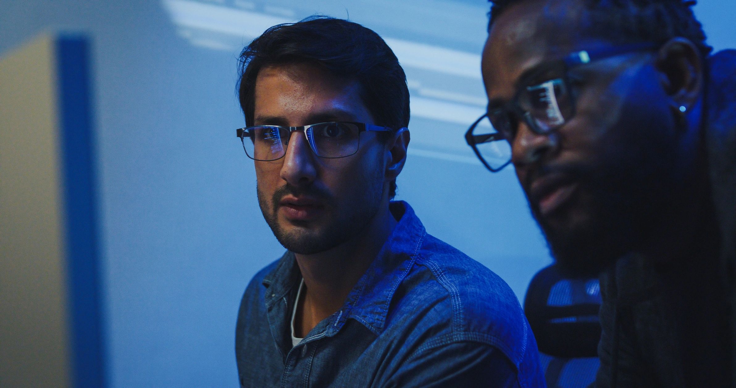 indie game developers cyberpunk neon workspace