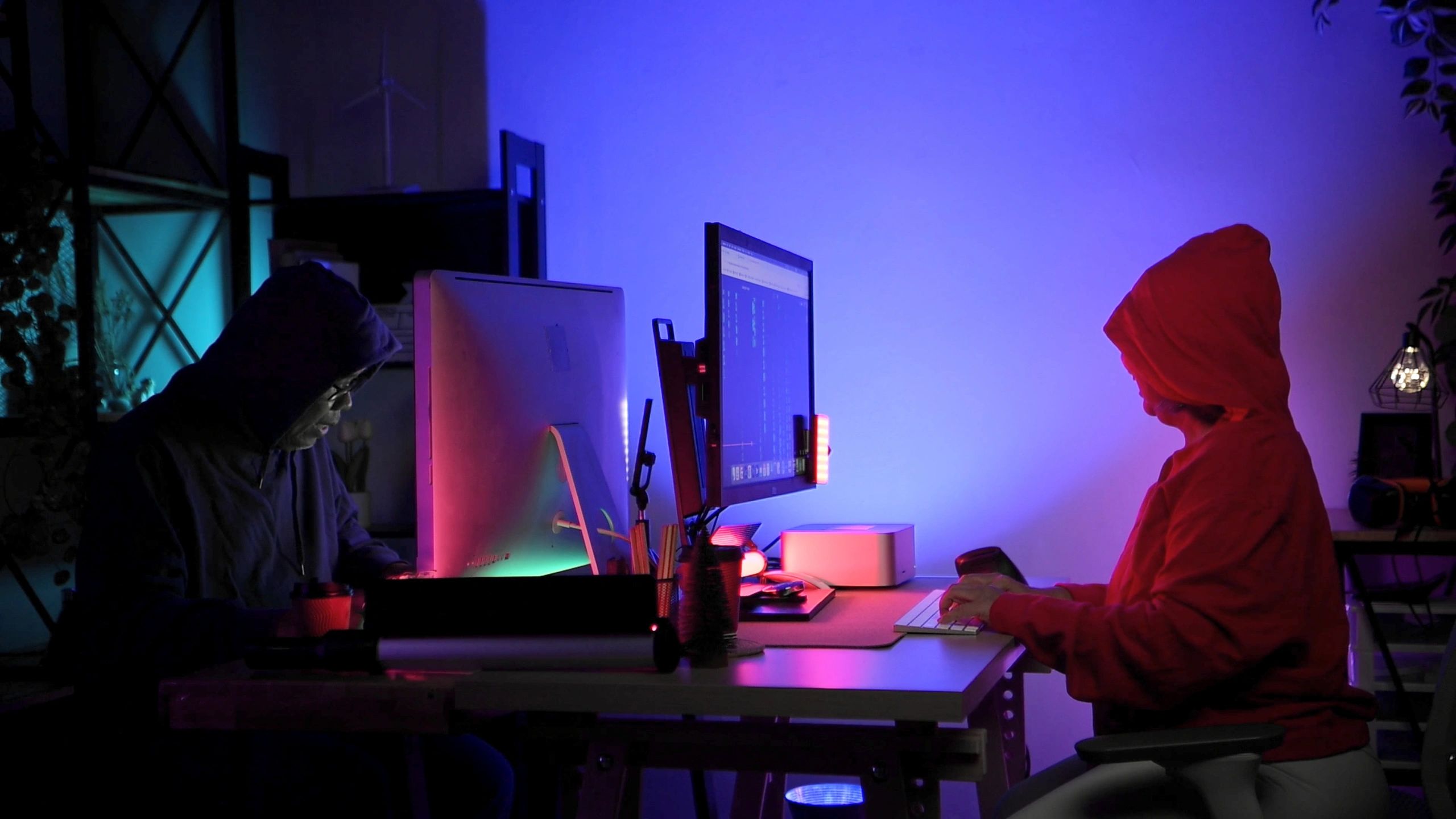 indie game developers cyberpunk neon workspace
